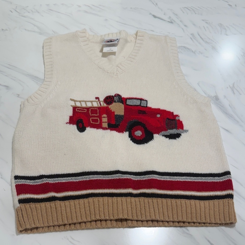 Goodl Lad vest with fire truck design on front in size 5. Excellent condition.